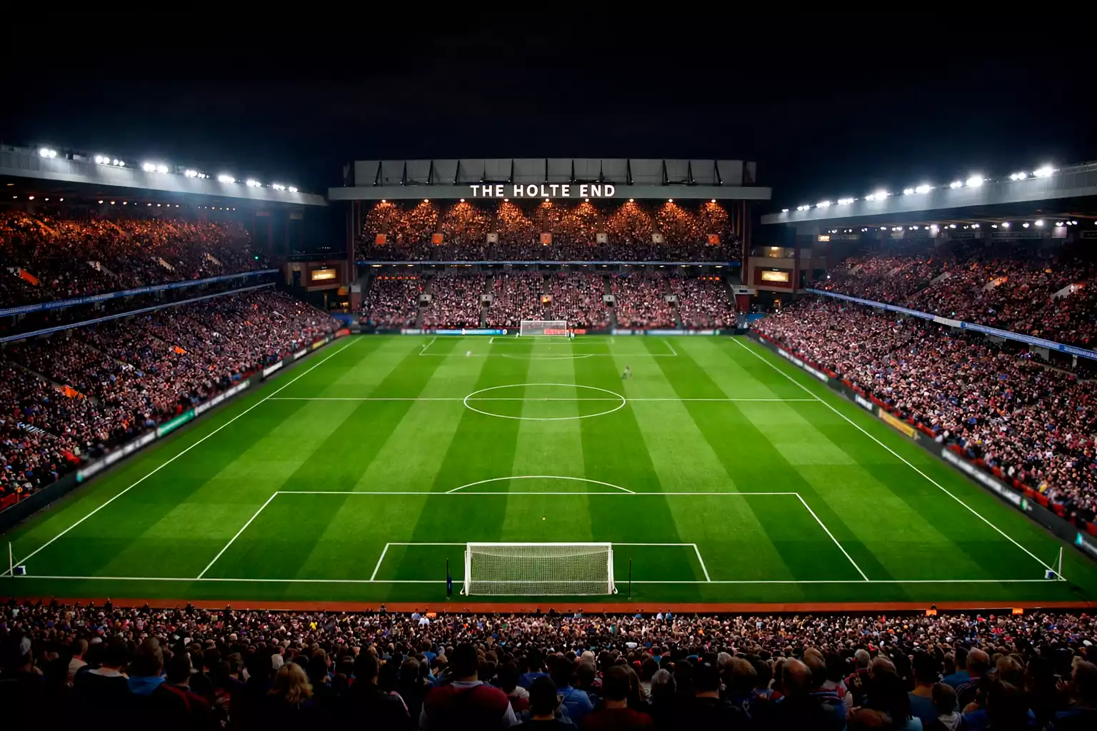 Estadio Villa Park iluminado de noche durante un partido europeo de fútbol